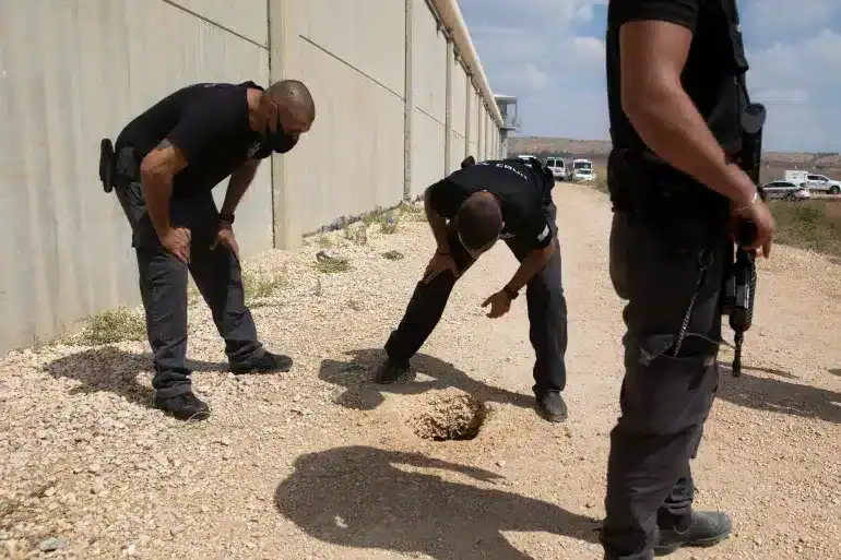 Israeli authorities inspect the scene of a prison escape outside Gilboa prison. Photo Credit: Sebastien Scheiner, Associated Press