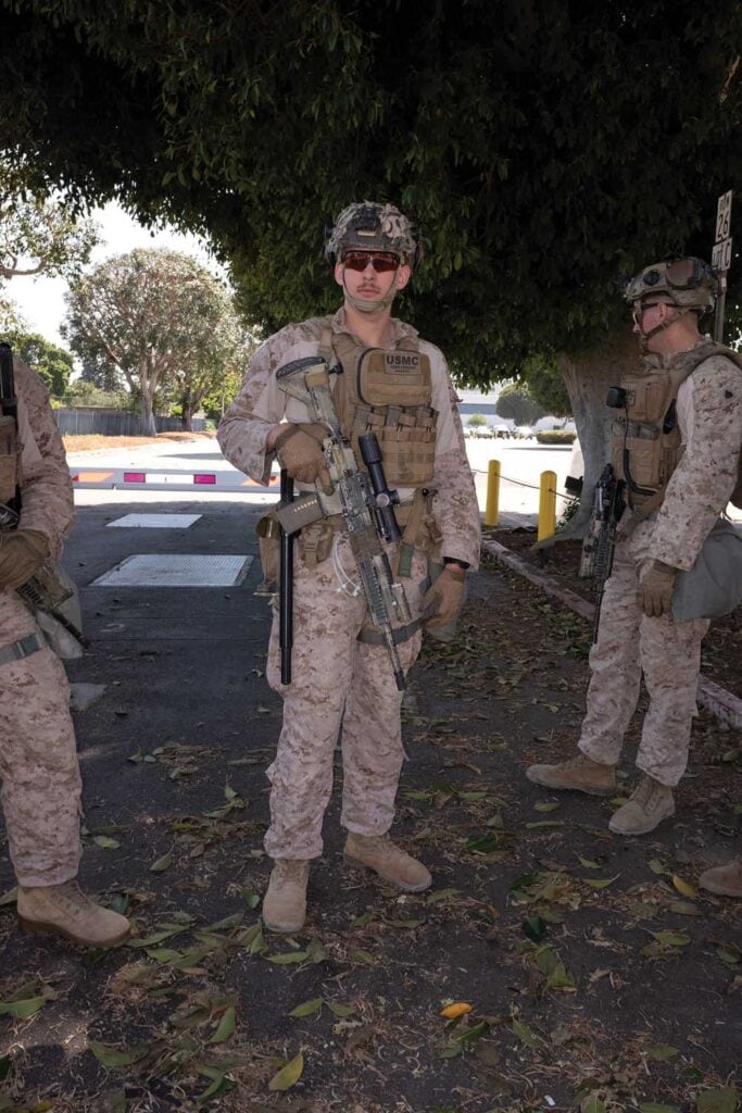 US Marines, deployed to protect federal agents and assets during protests against the immigration raids, idle outside the Wilshire Federal Building in West LA, June 22, 2025.