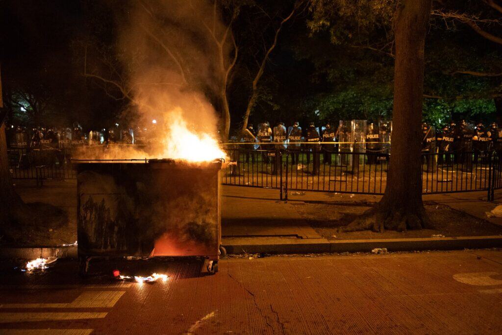 Burning dumpster at George Floyd protests in Washington DC, Lafayette Square. Photo Credit: Rosa Pineda via wikimedia