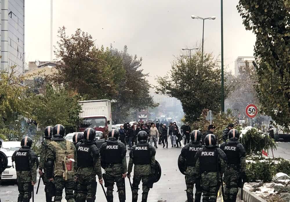 Confrontation between protesters and the state forces during the Aban protests, 2019. Photo Credit: Alireza Vahabzadeh via Wikimedia