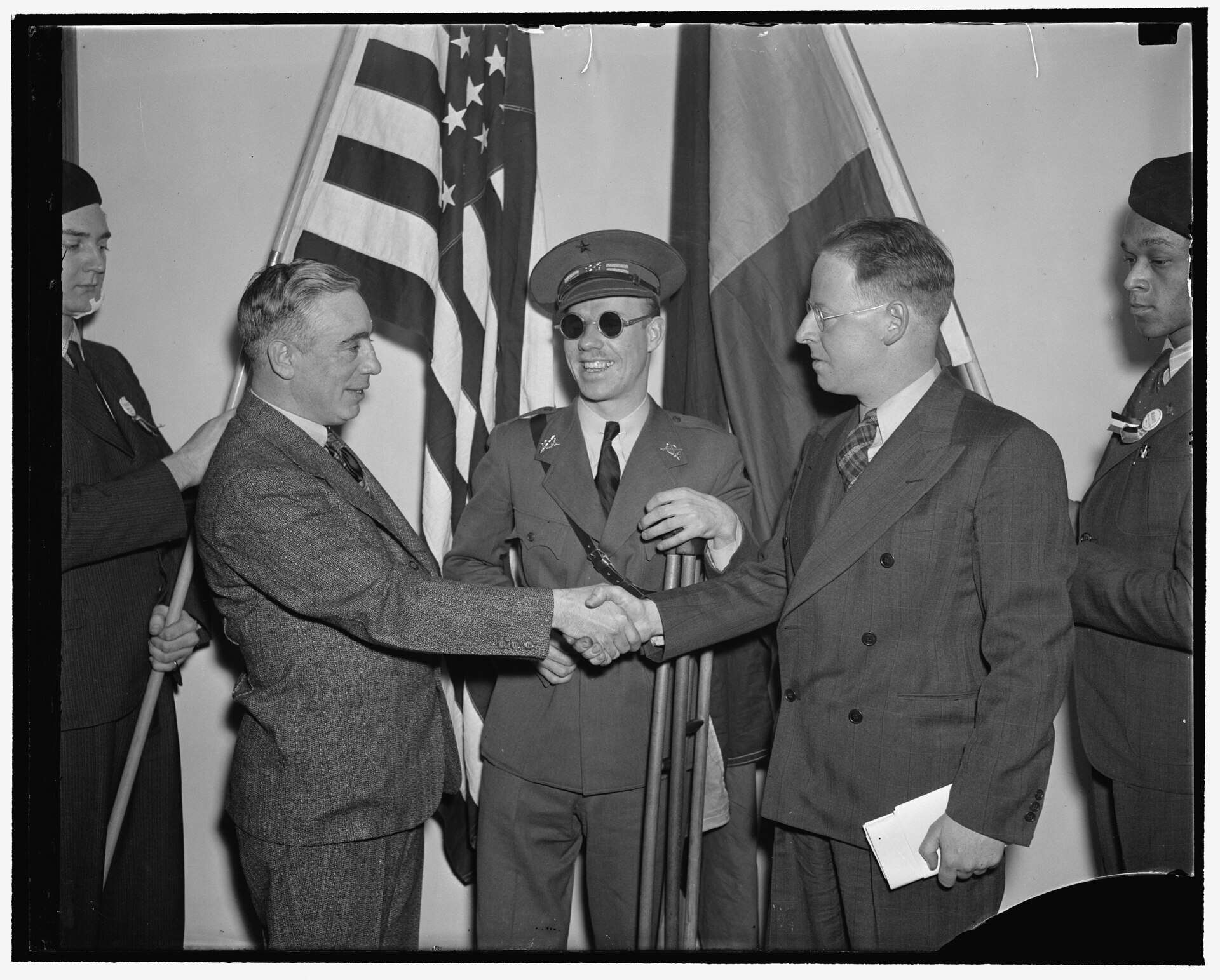 Communists get together. Washington, D.C., Feb. 12. Americans, all of whom fought and many wounded while fighting for the Loyalists in Spain, met today in Washington at the First National Conference of the Veterans of the Abraham Lincoln Brigade, left to right: Francis J. Gorman, President of the United Textile Workers of America; Lieut. Robert Raven, wounded and blinded in the Spanish War; and Commander Paul Burns of Boston Commander of the Lincoln Brigade, 2/12/38 Photo Credit: Harris & Ewing via Wikimedia