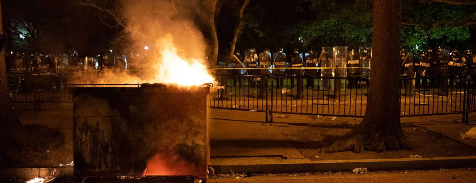Burning dumpster at George Floyd protests in Washington DC, Lafayette Square. Photo Credit: Rosa Pineda via wikimedia