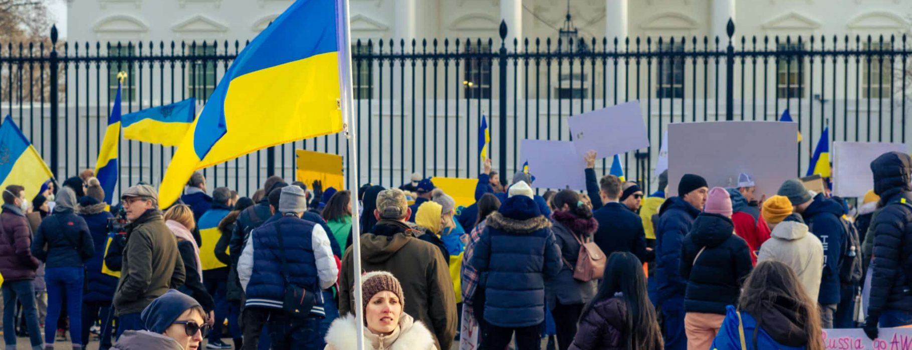 A small group of pro-Ukraine protesters, some with Ukrainian flags, protest for U.S. support in front of the Whtie House