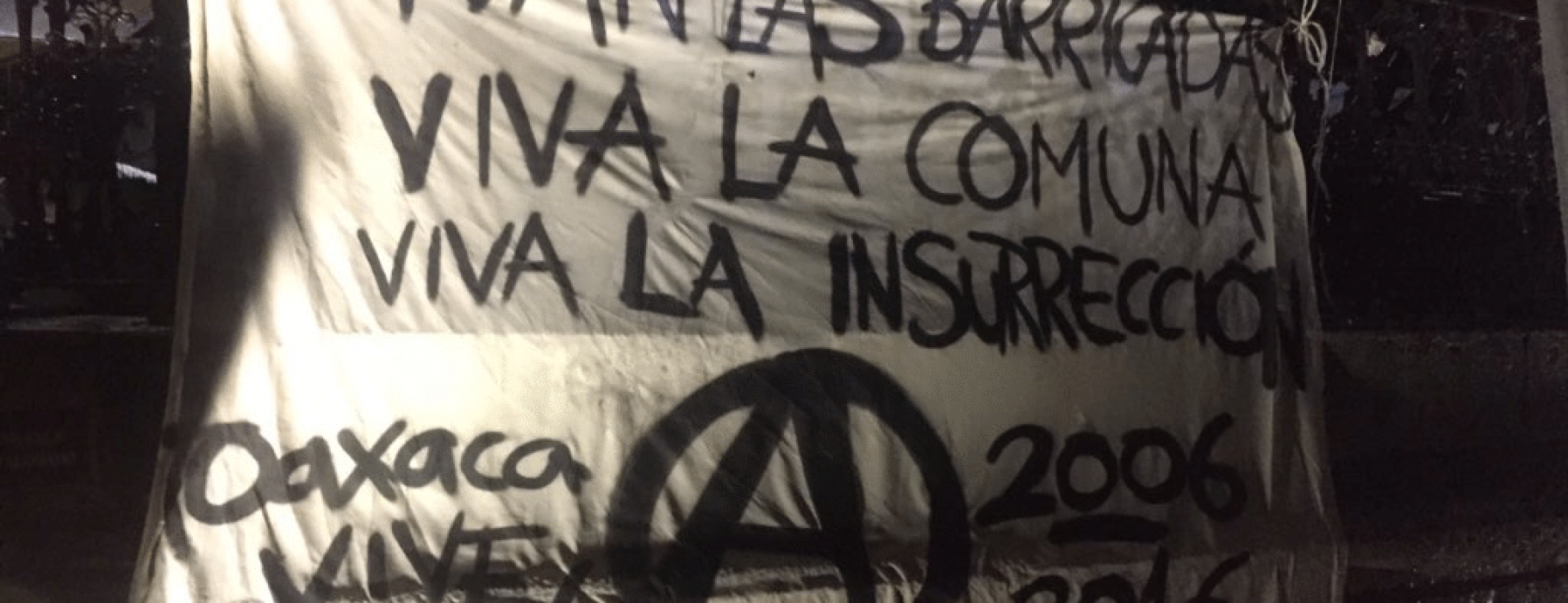A barricade in Oaxaca with revolutionary slogans.